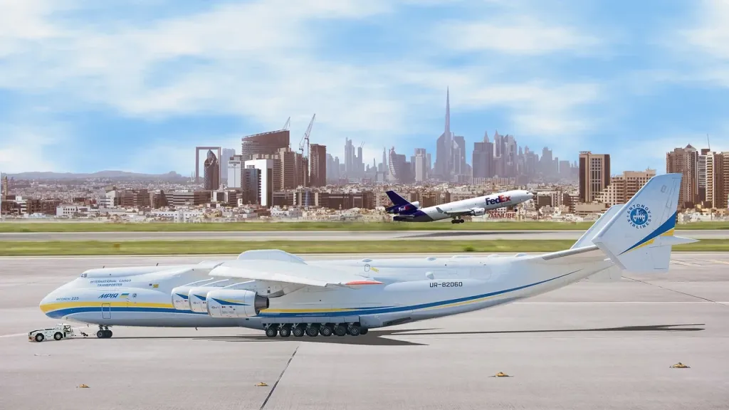 Nowoczesny terminal lotniska w Dubaju z widocznymi oznaczeniami kierunkowymi dla pasażerów tranzytowych.